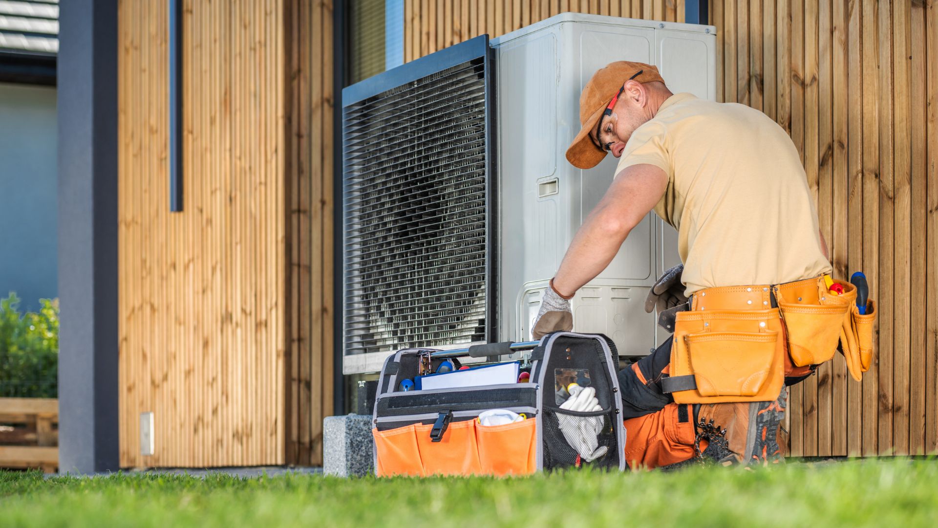 HVAC Technician Worker Fixing Heat Pump at House